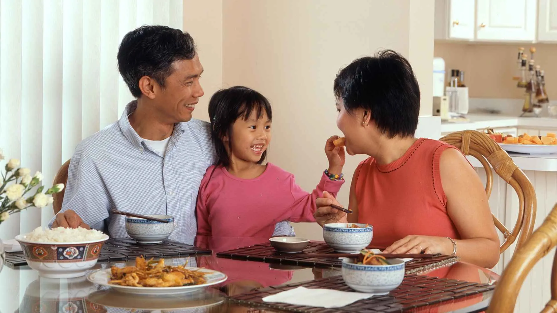 Happy Hawaii family in a comfortable, insulated home